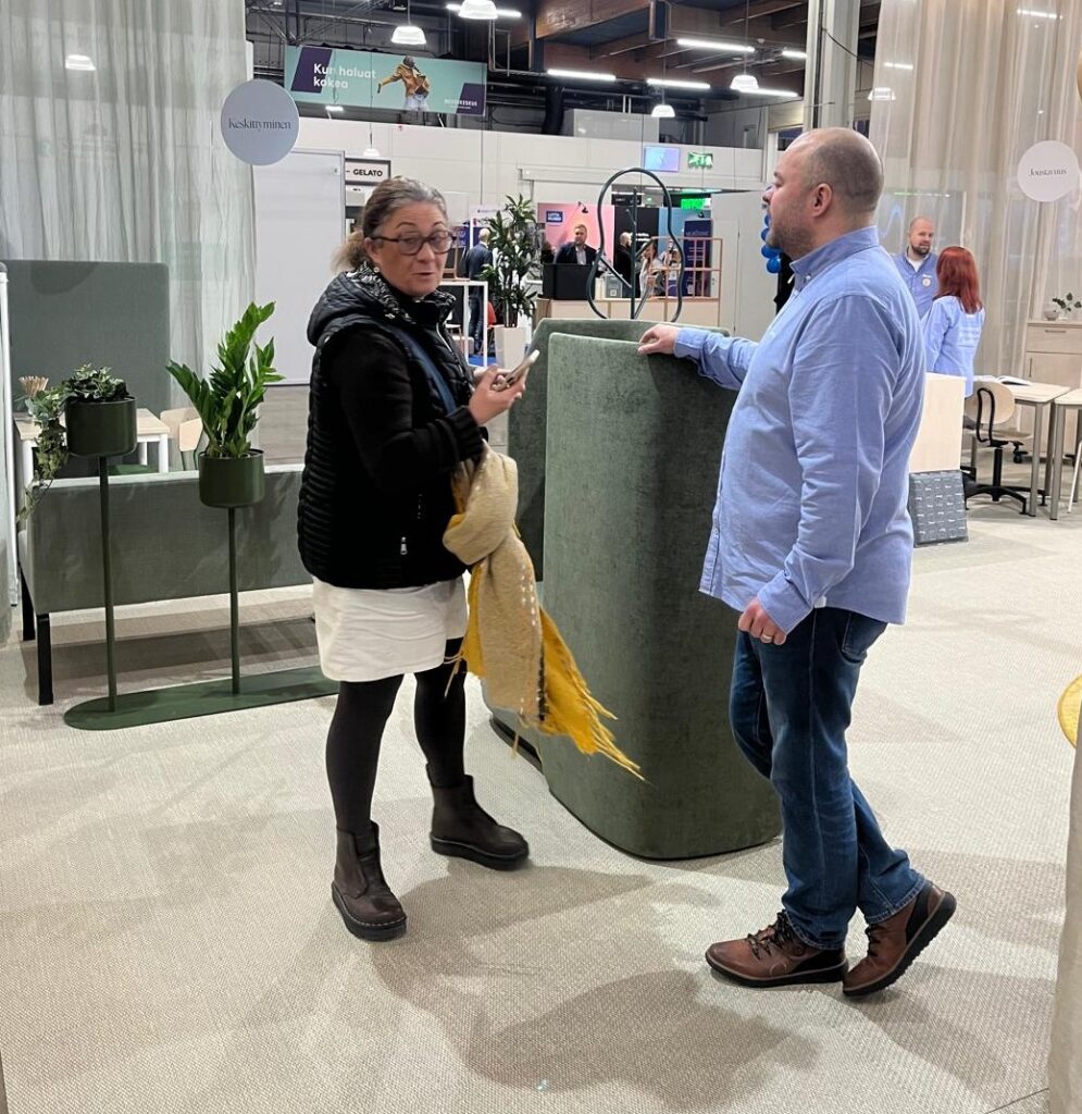 Numerous exhibitors linked to the education system – Anne Campilla talking to one of them